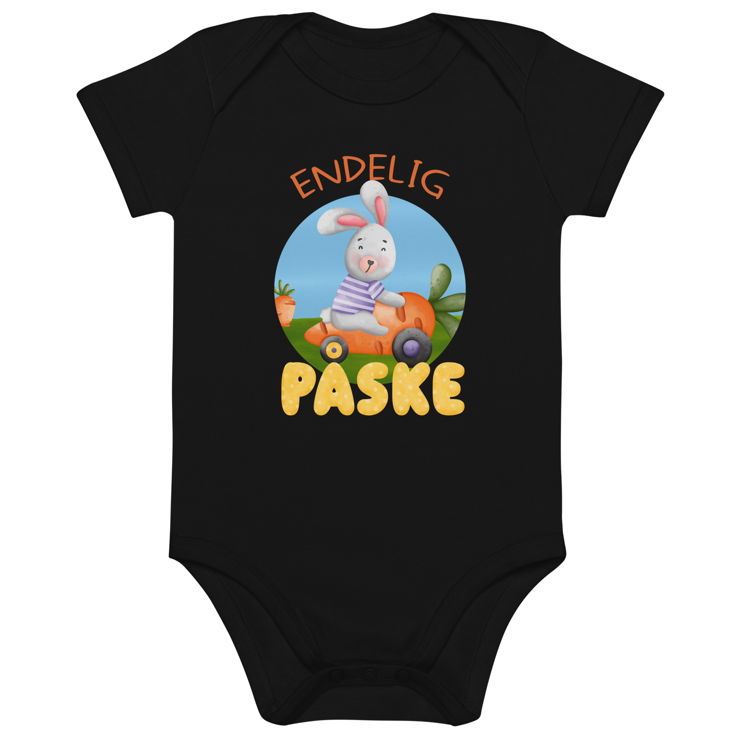 Svart babybody som ligger flatt, med teksten "Endelig påske" og figur av en glad kanin som kjører en gulrotbil. Foto.