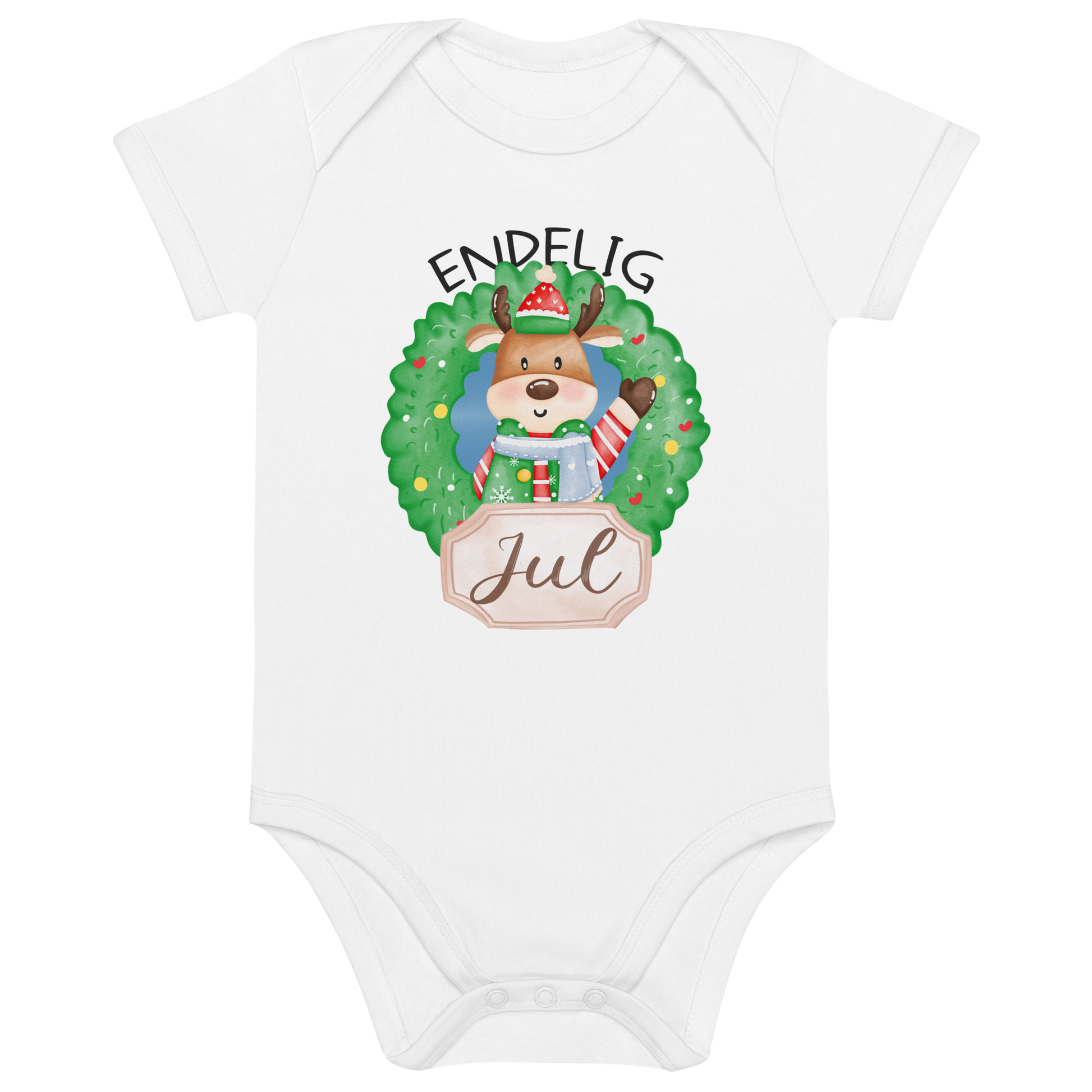 Hvit babybody som ligger flatt, med teksten "Endelig jul" og figur av en søt elg i julete klær med en julekrans rundt seg. Foto.