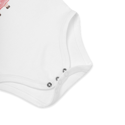 Babybody som ligger flatt, der bildet fokuserer på å vise trykknappene i kilen. Foto.