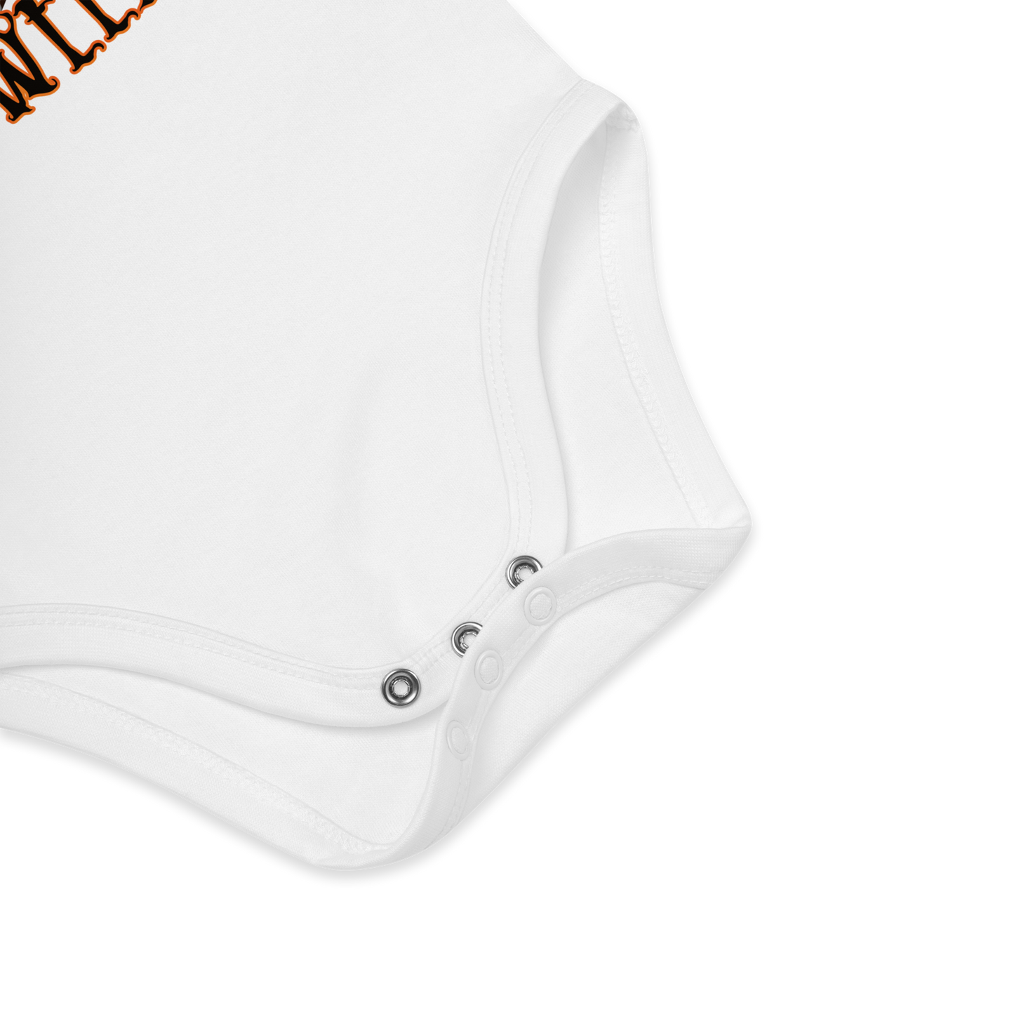 Babybody som ligger flatt, der bildet fokuserer på å vise trykknappene i kilen. Foto.