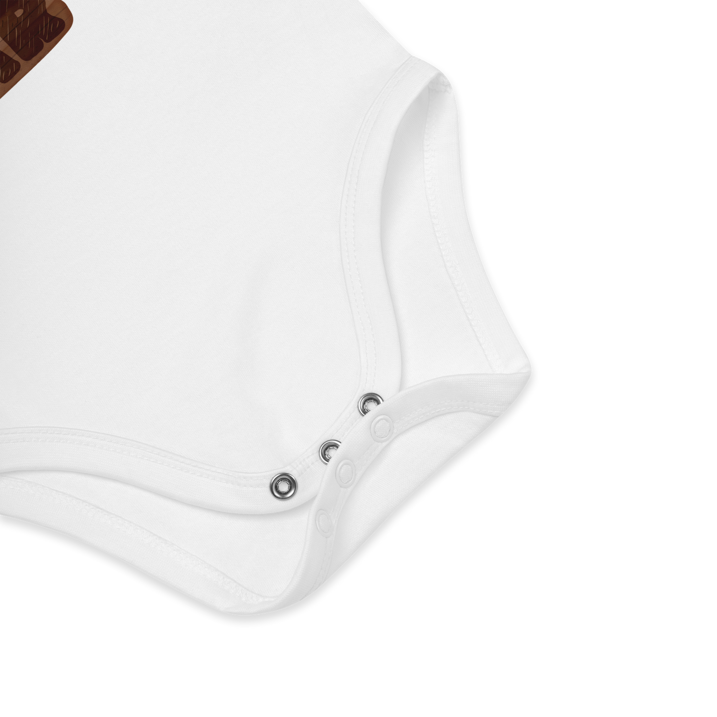 Babybody som ligger flatt, der bildet fokuserer på å vise trykknappene i kilen. Foto.